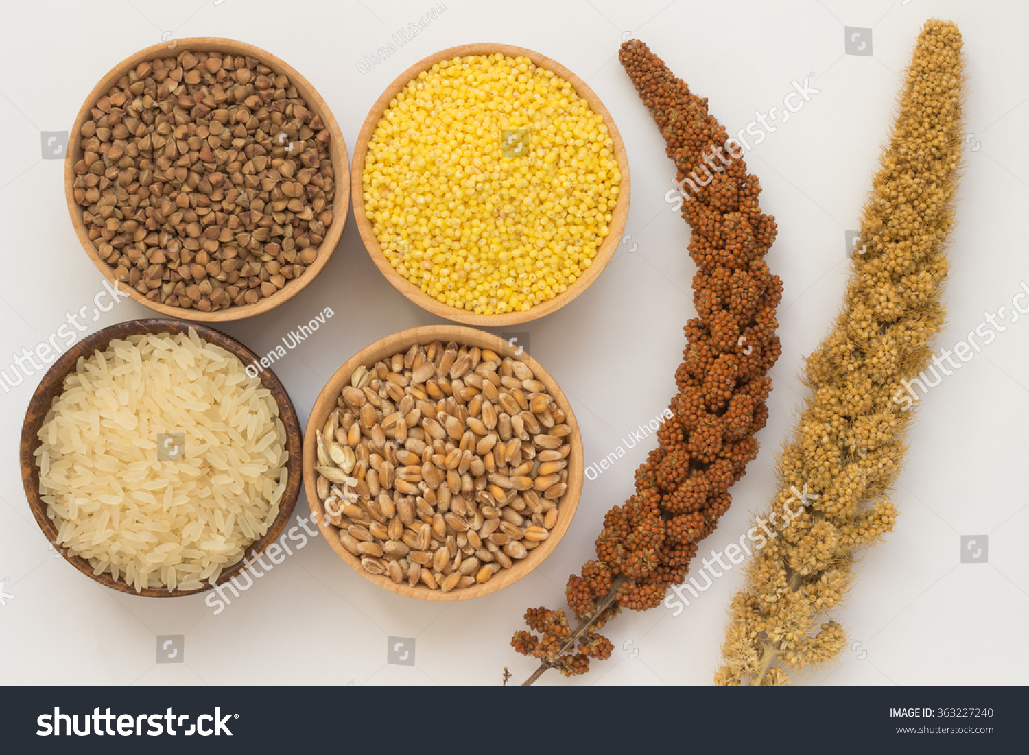 buckwheat, millet, rice and wheat in wooden boxes